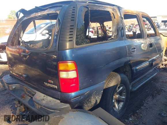 2003 GMC Yukon SLT with VIN 1GKEK13Z03R218556, listed as a IAAI auction lot 41019548 with 1 mi miles. Bid and sale history available at carsss.com. Image 4.
