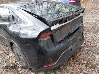 2023 Toyota Prius LE with VIN JTDACAAU8P3002140, listed as a IAAI auction lot 41812753 with 27,410 mi miles and . Bid and sale history available at carsss.com. Image 6.