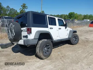 2015 Jeep Wrangler Unlimited Willys Wheeler with VIN 1C4BJWDG0FL546000, listed as a IAAI auction lot 41984566 with 112,742 mi miles and . Bid and sale history available at DreamBid. Image 4.
