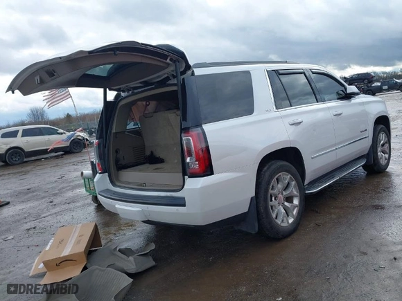 2016 GMC Yukon SLT with VIN 1GKS2BKCXGR195010, listed as a IAAI auction lot 41226537 with 130,919 mi miles. Bid and sale history available at carsss.com. Image 4.