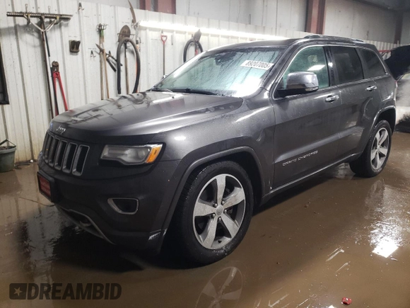 2015 Jeep Grand Cherokee Overland with VIN 1C4RJFCT2FC613502, listed as a Copart auction lot 89207005 with 124,482 mi miles and Salvage Title. Bid and sale history available at carsss.com. Image 1.