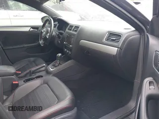 2014 Volkswagen Jetta GLI z VIN 3VW4T7AJ2EM208598, wystawiony jako IAAI lot #42381855 z przebiegiem 82 761 mil mil oraz . Historia ofert i sprzedaży dostępna na DreamBid. Obrazek 5.
