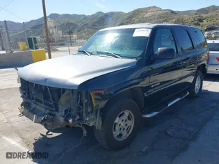 2001 Chevrolet Tahoe LT with VIN 1GNEC13T31R122882, listed as a IAAI auction lot 41999271 with 211,687 mi miles. Bid and sale history available at carsss.com. Image 2.