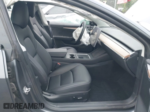 2023 Tesla Model 3 with VIN 5YJ3E1EA4PF705949, listed as a IAAI auction lot 42336682 with 88,056 mi miles and . Bid and sale history available at DreamBid. Image 5.