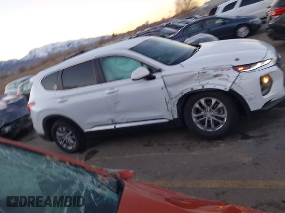 2019 Hyundai Santa Fe SE z VIN 5NMS23AD9KH077362, wystawiony jako IAAI lot #41890584 z przebiegiem 132 476 mil mil oraz . Historia ofert i sprzedaży dostępna na DreamBid. Obrazek 13.