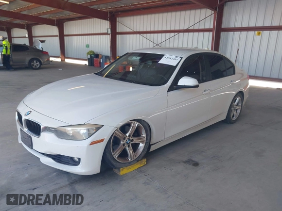 2013 BMW 3 Series 328i with VIN WBA3C1C50DF438180, listed as a IAAI auction lot 42082401 with 206,412 mi miles. Bid and sale history available at carsss.com. Image 2.
