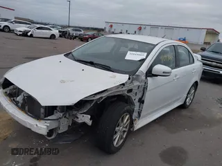 2016 Mitsubishi Lancer SE with VIN JA32V2FWXGU003619, listed as a IAAI auction lot 41041665 with 98,627 mi miles. Bid and sale history available at carsss.com. Image 2.