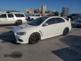 2014 Mitsubishi Lancer Evolution GSR with VIN JA32W8FV5EU023703, listed as a Copart auction lot 72744504 with 0 mi miles and Salvage Title. Bid and sale history available at carsss.com. Image 1.