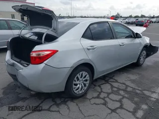 2019 Toyota Corolla L with VIN 5YFBURHE4KP929909, listed as a IAAI auction lot 42078797 with 131,741 mi miles. Bid and sale history available at carsss.com. Image 4.