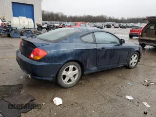 2003 Hyundai Tiburon GT z VIN KMHHN65F13U068658, wystawiony jako Copart lot #81799404 z przebiegiem 163 148 mil mil oraz Szkoda całkowita • Salvage title. Historia ofert i sprzedaży dostępna na DreamBid. Obrazek 3.