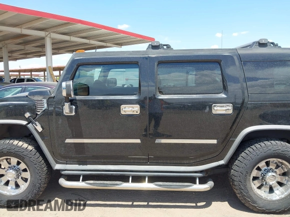 2003 Hummer H2 with VIN 5GRGN23U73H122756, listed as a IAAI auction lot 42194176 with 239,411 mi miles. Bid and sale history available at carsss.com. Image 14.