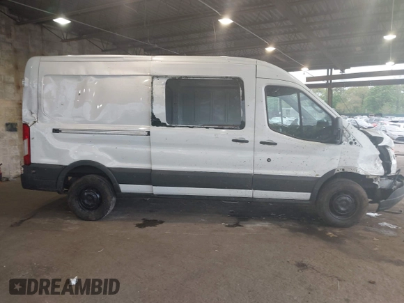 2015 Ford Transit Cargo z VIN 1FTNR2CM1FKA40154, wystawiony jako IAAI lot #42210986 z przebiegiem 164 324 mil mil oraz . Historia ofert i sprzedaży dostępna na DreamBid. Obrazek 13.