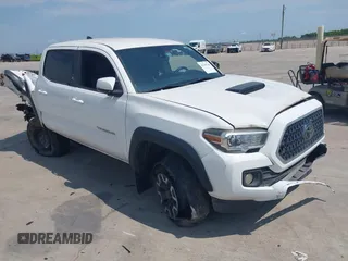 2019 Toyota Tacoma SR5 with VIN 5TFAZ5CN5KX085734, listed as a IAAI auction lot 42345760 with 73,928 mi miles and . Bid and sale history available at DreamBid. Image 1.