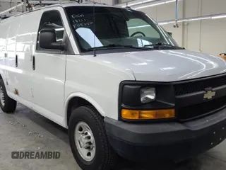 2015 Chevrolet Express Cargo Van with VIN 1GCWGFCB2F1151740, listed as a IAAI auction lot 42175679 with 59,065 mi miles. Bid and sale history available at carsss.com. Image 1.