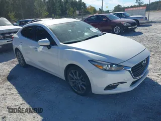 2018 Mazda 3 Touring z VIN 3MZBN1V3XJM184135, wystawiony jako IAAI lot #37977044 z przebiegiem 85 740 mil mil oraz . Historia ofert i sprzedaży dostępna na DreamBid. Obrazek 1.