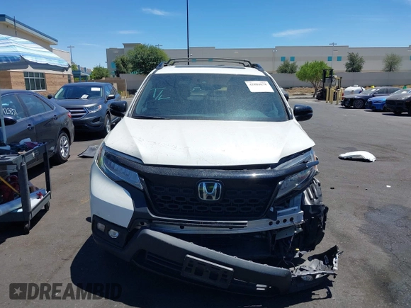 2019 Honda Passport Elite z VIN 5FNYF8H05KB009575, wystawiony jako IAAI lot #42804678 z przebiegiem 70 468 mil mil oraz . Historia ofert i sprzedaży dostępna na DreamBid. Obrazek 13.