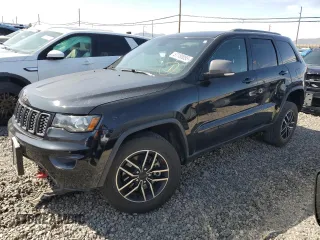 2019 Jeep Grand Cherokee Trailhawk with VIN 1C4RJFLT5KC856652, listed as a Copart auction lot 57180055 with 84,865 mi miles and Salvage title. Bid and sale history available at DreamBid. Image 1.