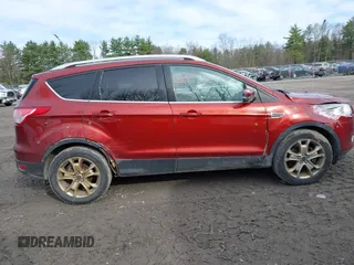 2015 Ford Escape Titanium with VIN 1FMCU9JX1FUA56091, listed as a IAAI auction lot 41947035 with 191,297 mi miles and . Bid and sale history available at DreamBid. Image 13.
