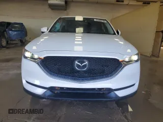 2019 Mazda CX-5 Touring with VIN JM3KFBCM1K0697500, listed as a Copart auction lot 46460735 with 69,412 mi miles and Salvage Title. Bid and sale history available at carsss.com. Image 5.