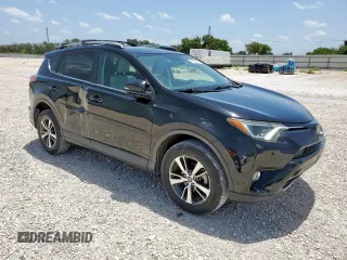2018 Toyota RAV4 XLE with VIN 2T3WFREV7JW429716, listed as a Copart auction lot 64309045 with 156,445 mi miles and Salvage title. Bid and sale history available at DreamBid. Image 4.
