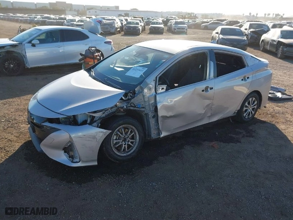 2021 Toyota Prius Prime LE with VIN JTDKAMFP1M3178179, listed as a IAAI auction lot 41233411 with 83,035 mi miles. Bid and sale history available at carsss.com. Image 2.