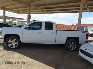 2015 Chevrolet Silverado 1500 LT with VIN 1GCVKREC1FZ415386, listed as a IAAI auction lot 42142990 with 165,409 mi miles and . Bid and sale history available at DreamBid. Image 14.