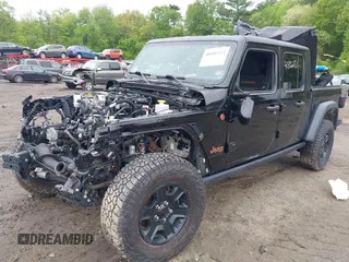 2021 Jeep Gladiator Mojave z VIN 1C6JJTEG9ML605638, wystawiony jako IAAI lot #40302253 z przebiegiem 32 019 mil mil oraz . Historia ofert i sprzedaży dostępna na DreamBid. Obrazek 2.