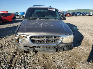 1999 Ford Explorer XL with VIN 1FMZU34X8XUC31019, listed as a Copart auction lot 87831635 with 220,683 mi miles and Salvage title. Bid and sale history available at DreamBid. Image 5.