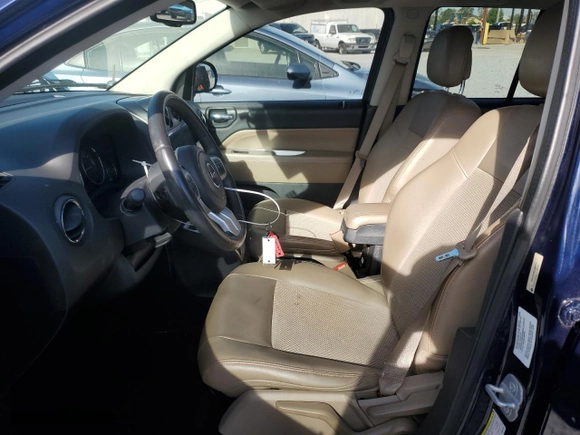 2014 Jeep Compass Latitude with VIN 1C4NJCEB9ED660326, listed as a Copart auction lot 50582145 with 60,712 mi miles and Salvage Title. Bid and sale history available at carsss.com. Image 7.