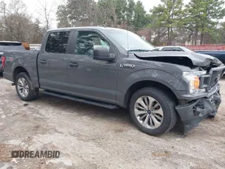 2018 Ford F-150 XL with VIN 1FTEW1CP4JFD00156, listed as a IAAI auction lot 41571979 with 153,167 mi miles. Bid and sale history available at carsss.com. Image 1.