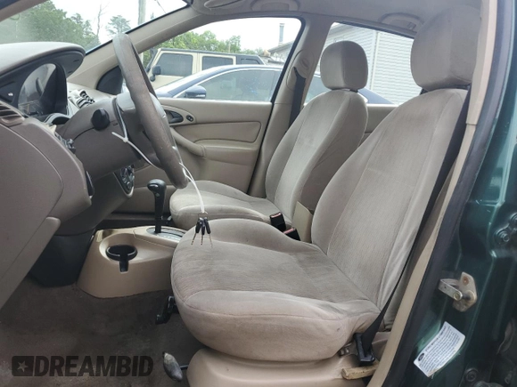2000 Ford Focus SE with VIN 1FAFP3433YW354797, listed as a Copart auction lot 61430265 with 165,202 mi miles and Salvage title. Bid and sale history available at DreamBid. Image 7.