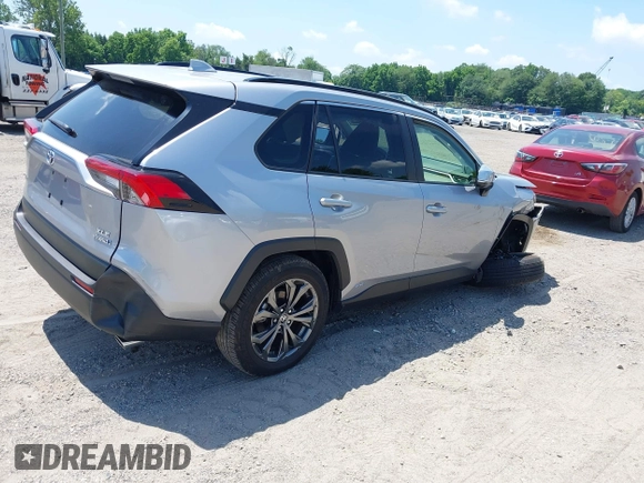 2022 Toyota RAV4 Hybrid XLE Premium with VIN JTMB6RFV1ND063963, listed as a IAAI auction lot 42550907 with 35,012 mi miles and . Bid and sale history available at DreamBid. Image 4.