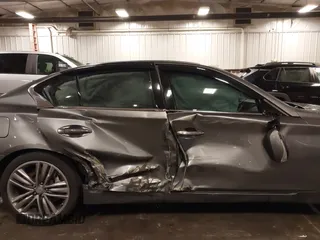 2014 Infiniti Q50 Premium with VIN JN1BV7ARXEM699902, listed as a IAAI auction lot 42135410 with 103,929 mi miles and . Bid and sale history available at DreamBid. Image 6.