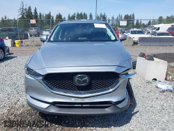 2018 Mazda CX-5 Grand Touring z VIN JM3KFADM7J0318684, wystawiony jako IAAI lot #42226937 z przebiegiem 69 166 mil mil oraz . Historia ofert i sprzedaży dostępna na DreamBid. Obrazek 12.