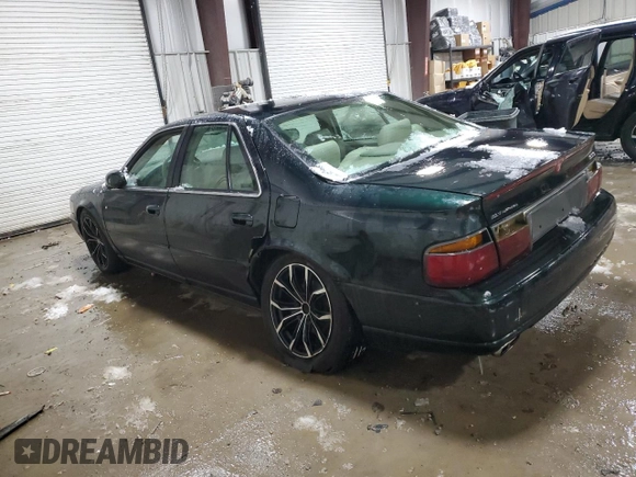 2000 Cadillac Seville Touring STS z VIN 1G6KY5494YU220613, wystawiony jako Copart lot #87338724 z przebiegiem 106 313 mil mil oraz Szkoda całkowita • Salvage title. Historia ofert i sprzedaży dostępna na DreamBid. Obrazek 2.