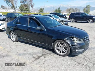 2014 Mercedes-Benz C-Class C 250 Sport with VIN WDDGF4HB5EG219437, listed as a IAAI auction lot 41847571 with 104,981 mi miles. Bid and sale history available at carsss.com. Image 1.