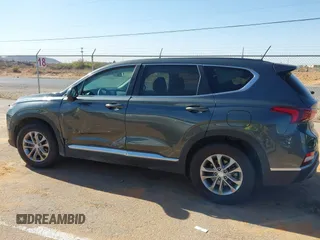 2019 Hyundai Santa Fe SE with VIN 5NMS23AD2KH134016, listed as a IAAI auction lot 41977240 with 61,448 mi miles and . Bid and sale history available at DreamBid. Image 14.