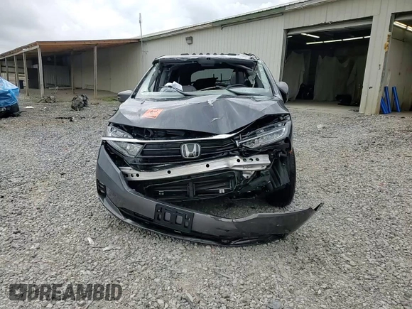 2023 Honda Odyssey Elite with VIN 5FNRL6H98PB056770, listed as a Copart auction lot 56984055 with Not provided miles and Salvage title. Bid and sale history available at DreamBid. Image 14.
