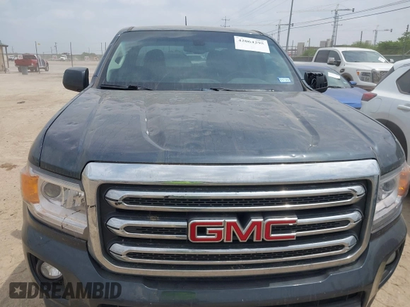 2019 GMC Canyon 4WD SLE z VIN 1GTG6CENXK1261278, wystawiony jako IAAI lot #42064295 z przebiegiem 51 786 mil mil oraz . Historia ofert i sprzedaży dostępna na DreamBid. Obrazek 6.