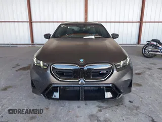 2025 BMW 5 Series with VIN WBS83FK04SCU11874, listed as a IAAI auction lot 42543784 with 4,517 mi miles and . Bid and sale history available at DreamBid. Image 12.