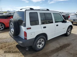 1996 Geo Tracker z VIN 2CNBE1364T6909947, wystawiony jako Copart lot #54411835 z przebiegiem 171 862 mil mil oraz Szkody całkowita. Historia ofert i sprzedaży dostępna na DreamBid. Obrazek 3.
