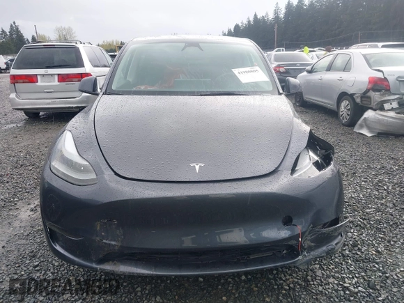 2023 Tesla Model Y Long Range with VIN 7SAYGAEE4PF871281, listed as a IAAI auction lot 41989805 with 15,501 mi miles. Bid and sale history available at carsss.com. Image 13.