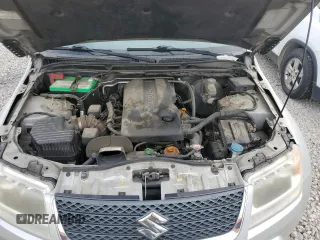 2010 Suzuki Grand Vitara Limited z VIN JS3TE0D73A4100112, wystawiony jako Copart lot #50907365 z przebiegiem 146 484 mil mil oraz Szkoda całkowita • Salvage title. Historia ofert i sprzedaży dostępna na DreamBid. Obrazek 12.