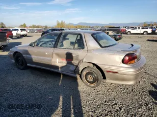 1996 Pontiac Grand Am SE2 with VIN 1G2NE52T3TC834038, listed as a Copart auction lot 76610794 with 140,379 mi miles and Salvage Title. Bid and sale history available at carsss.com. Image 2.