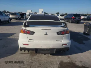 2014 Mitsubishi Lancer Evolution GSR z VIN JA32W8FV5EU023703, wystawiony jako Copart lot #72744504 z przebiegiem Nie podano mil oraz Szkody całkowita. Historia ofert i sprzedaży dostępna na DreamBid. Obrazek 6.