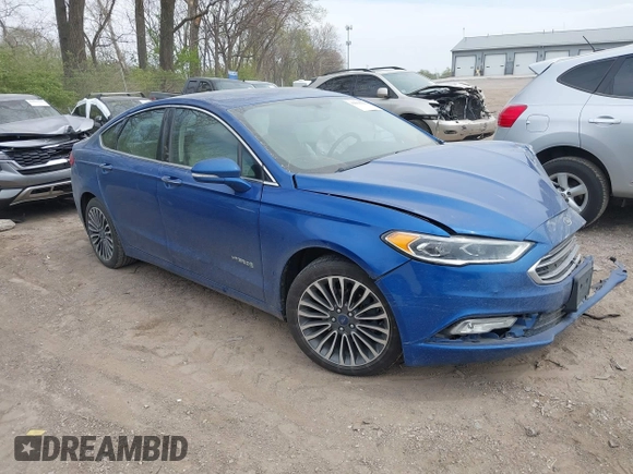 2017 Ford Fusion Hybrid Titanium с VIN 3FA6P0RU5HR388615, выставлен на аукционе IAAI как лот 42066142 с пробегом 121 618 миль миль и . История ставок и продаж доступна на DreamBid. Изображение 1.