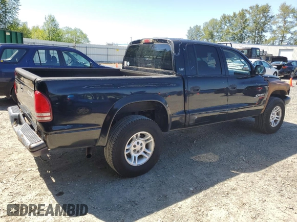 2001 Dodge Dakota Sport z VIN 1B7GG2AN81S113605, wystawiony jako Copart lot #58990065 z przebiegiem 243 919 mil mil oraz Czysty tytuł • Clean title. Historia ofert i sprzedaży dostępna na DreamBid. Obrazek 3.