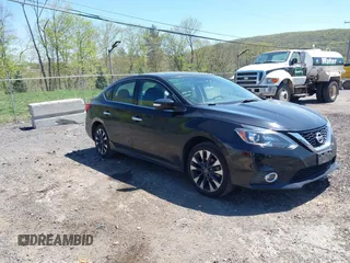 2019 Nissan Sentra S z VIN 3N1AB7APXKY313183, wystawiony jako IAAI lot #42133666 z przebiegiem 69 679 mil mil oraz . Historia ofert i sprzedaży dostępna na DreamBid. Obrazek 1.