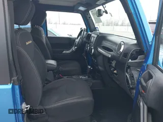2014 Jeep Wrangler Arctic z VIN 1C4GJWBG3EL313350, wystawiony jako IAAI lot #41442520 z przebiegiem Nie podano mil oraz . Historia ofert i sprzedaży dostępna na DreamBid. Obrazek 5.