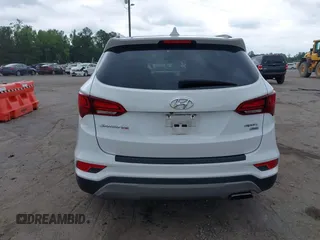 2018 Hyundai Santa Fe 2.4L z VIN 5XYZUDLB1JG543837, wystawiony jako IAAI lot #42235471 z przebiegiem 157 909 mil mil oraz . Historia ofert i sprzedaży dostępna na DreamBid. Obrazek 16.